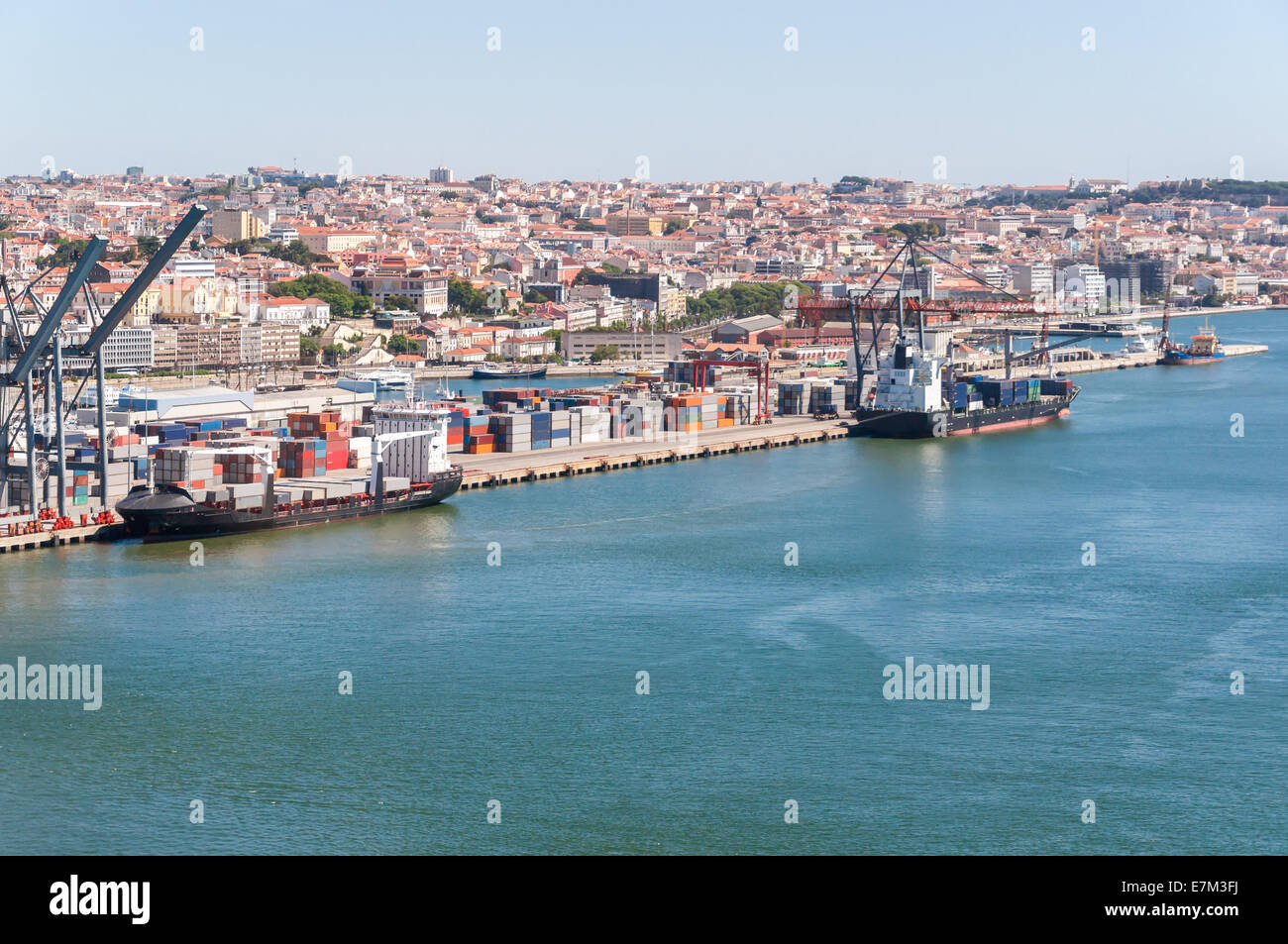 Container ships on loading terminal of Lisbon port on Tagus River Stock Photo