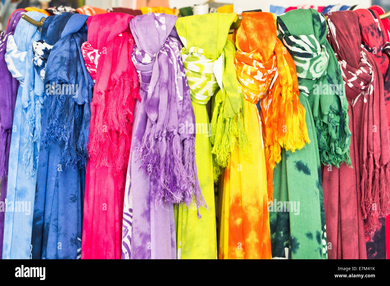 Selection of colorful women's scarves at a market Stock Photo