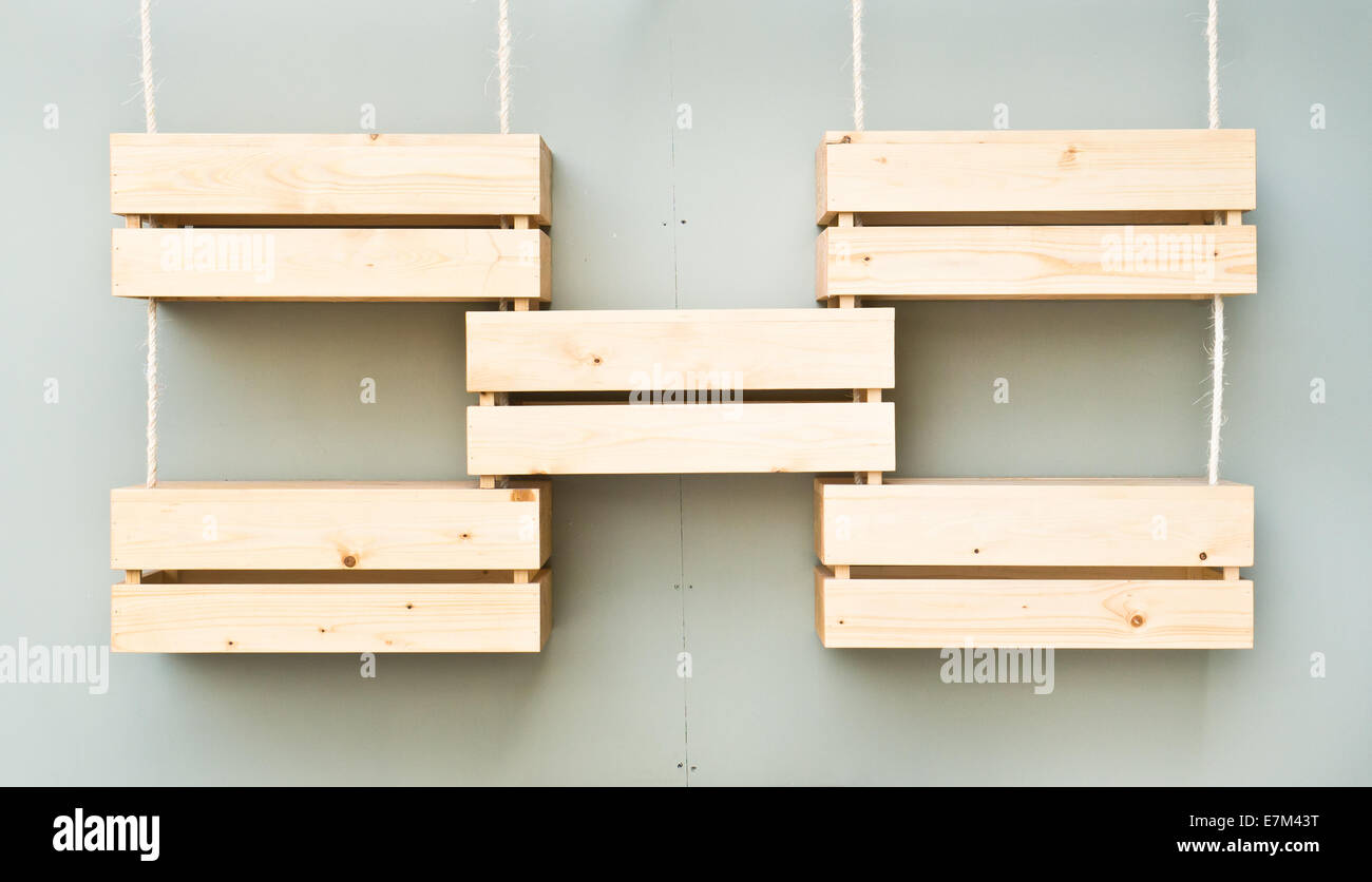 Five wooden display crates hanging on a wall Stock Photo Alamy