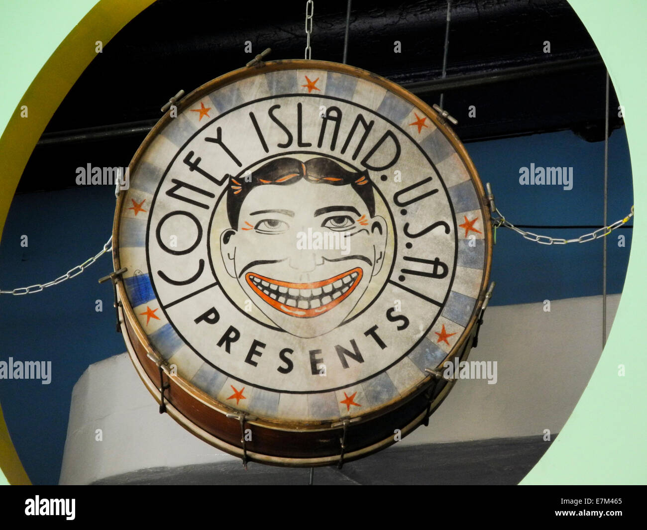 An old drum at Coney Island, New York City, shows a caricature advertisement for long-gone Steeplechase Park, once a major attraction at the famous amusement park. Stock Photo