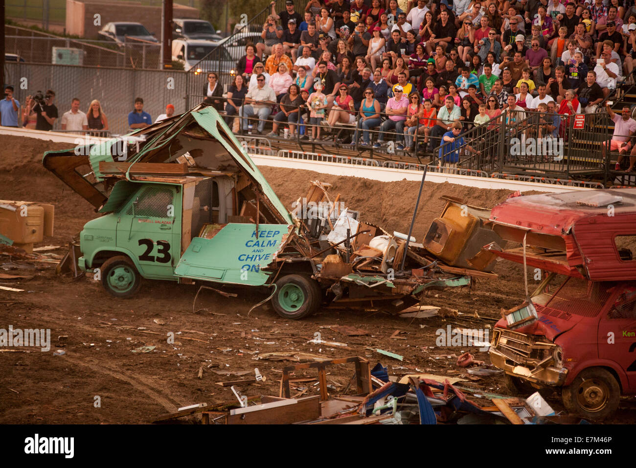 Brightly painted motor homes are disintegrated in a demolition derby at