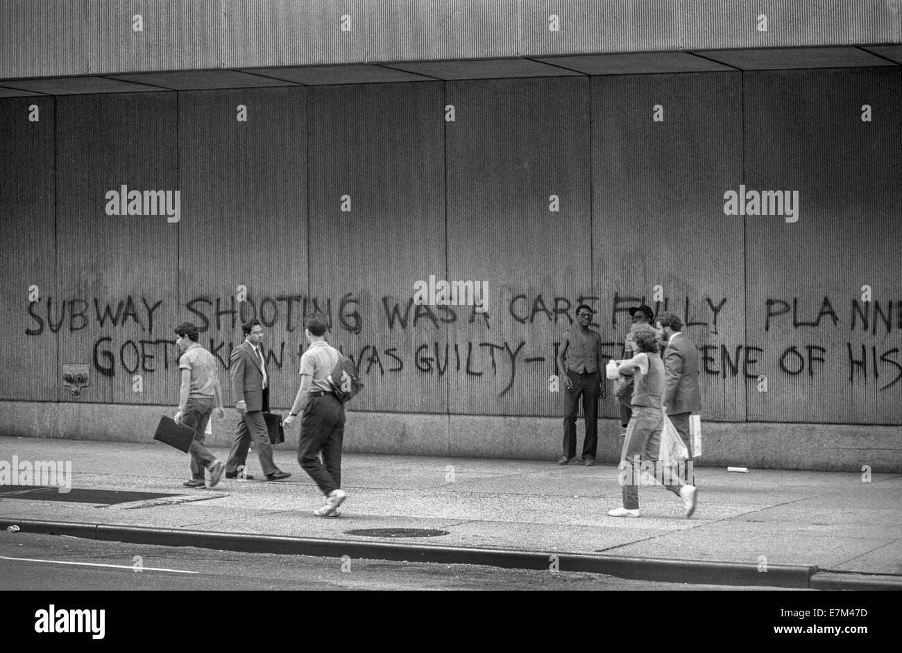 Graffiti on a wall in New York City in 1985 is critical of Bernard Goetz the so-called 'Subway Vigilante' who shot four African American men he claimed attempted to rob  him. Stock Photo