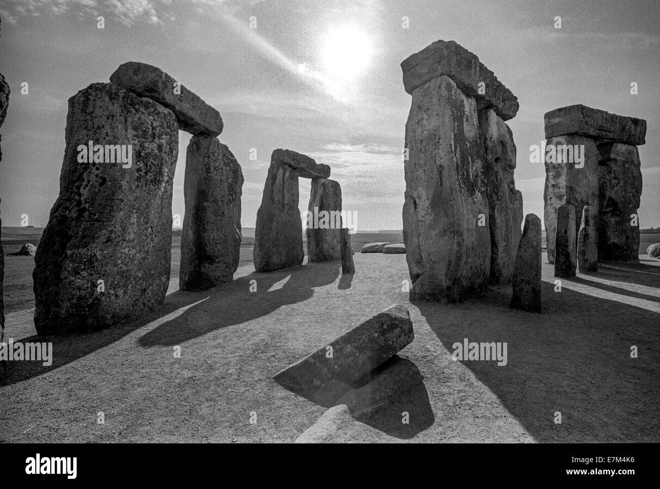 Late afternoon sum shines through Stonehenge, a prehistoric monument located in Wiltshire, England, on Salisbury Plain. Note long shadows. Stock Photo