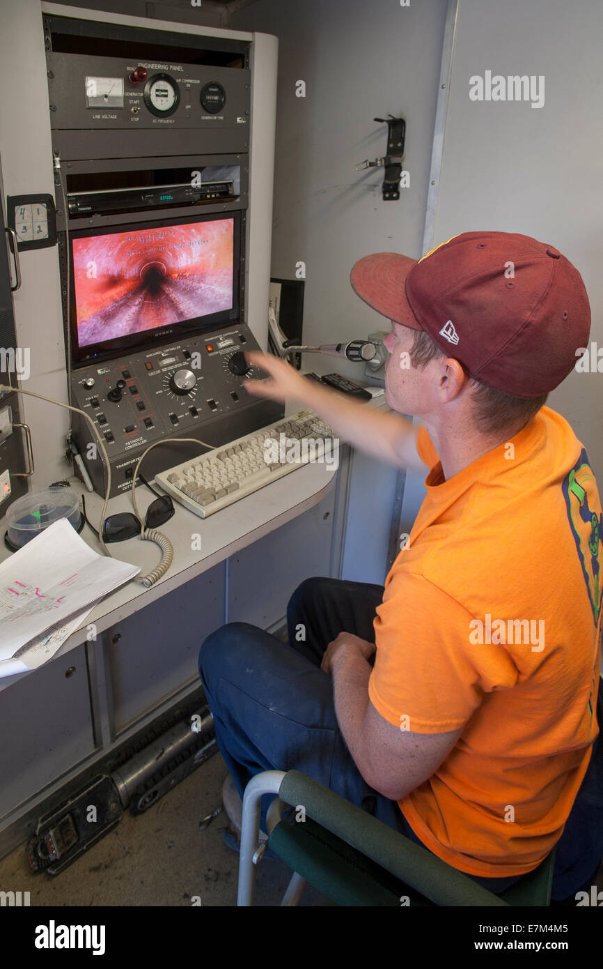 Plumber Remote Using a remote TV camera, a plumber inspects the interior of a ...