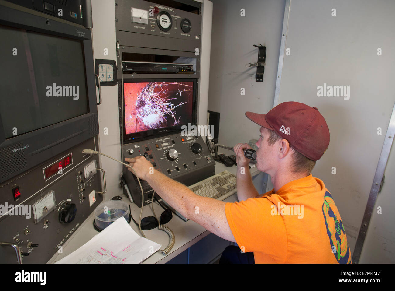 Plumber Remote Using a remote TV camera, a plumber inspects the interior of a ...