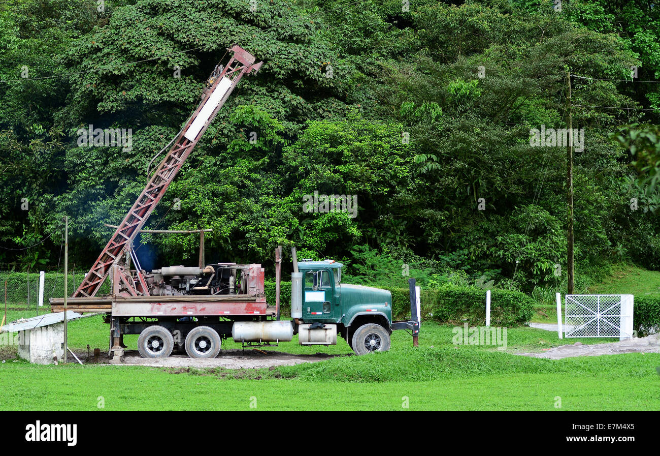 Old Drilling rig getting ready to drill a well in a farm Stock Photo