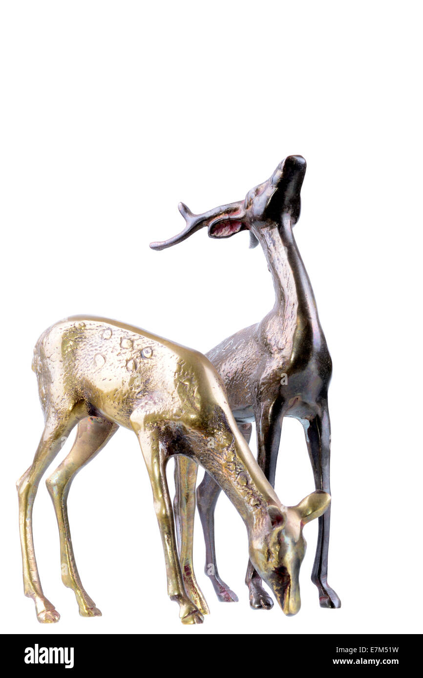 Bronze deer buck and doe figurines isolated on a white background Stock Photo