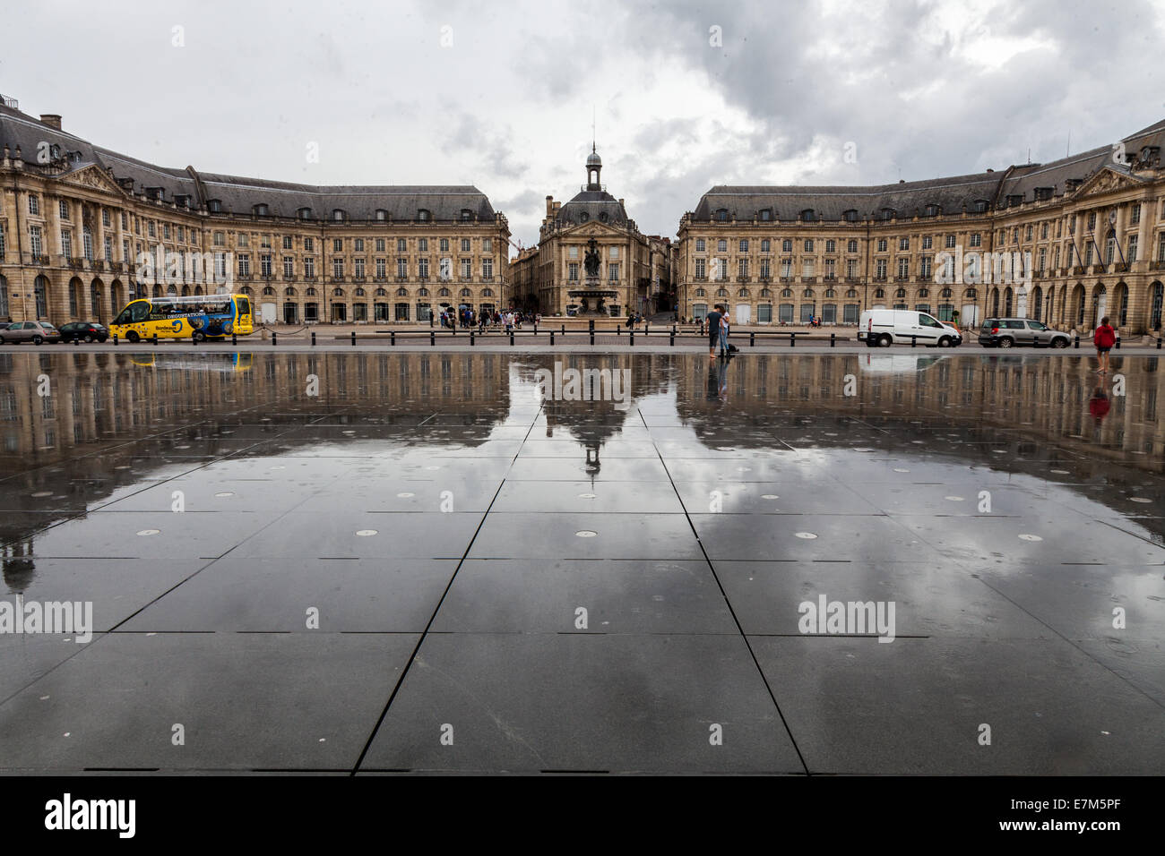The black granite of the Water Mirror, Miror d'eau, reflections of the  grand architecture of Bordeaux France Stock Photo - Alamy
