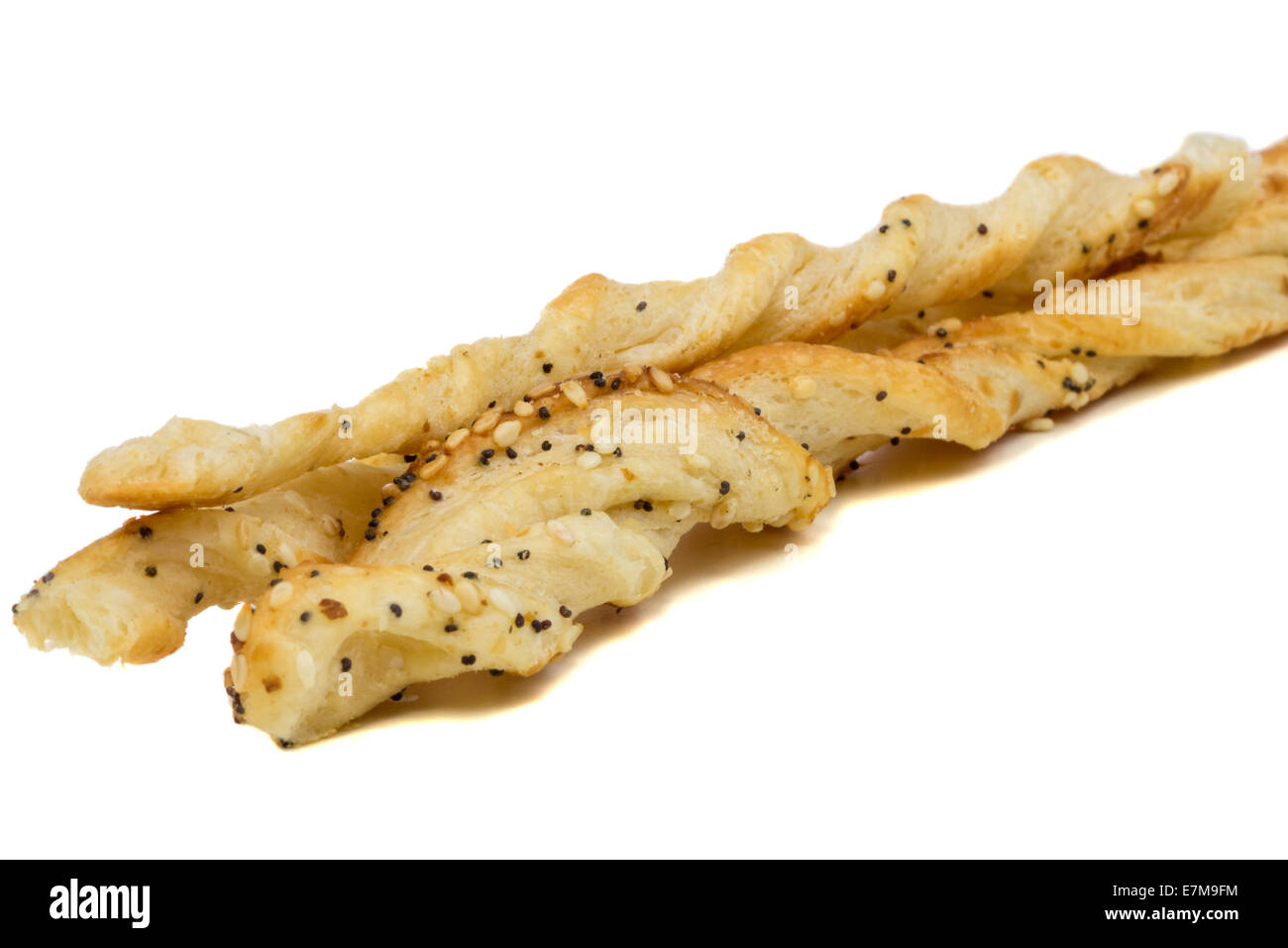 Close-up of some cheese twist pastry over white background Stock Photo