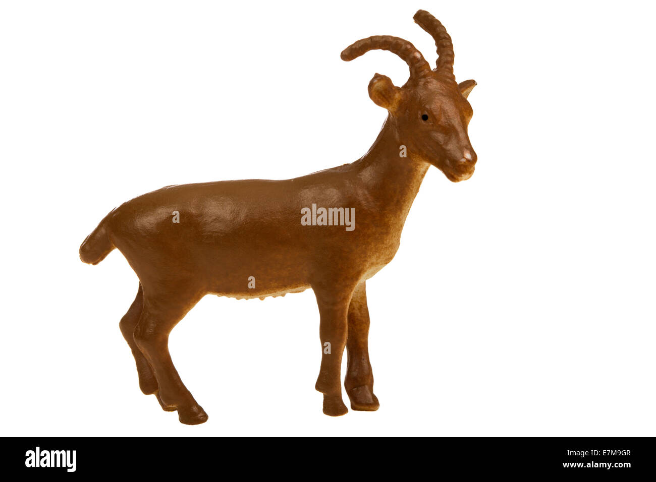 A brownish goat plastic toy for kids isolated on white background Stock Photo