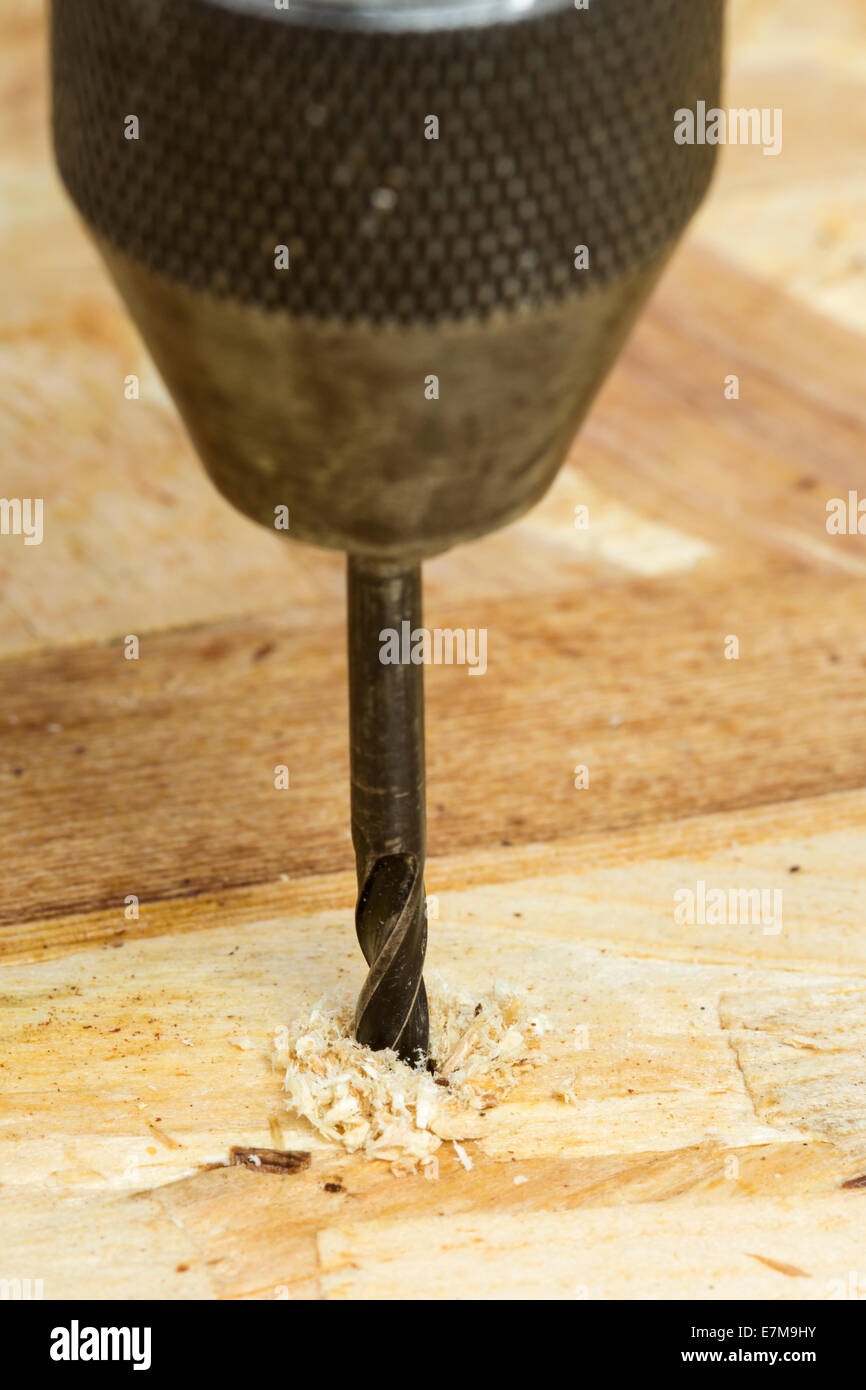 Close-up of Auger bit drilling wood - focus on wood Stock Photo