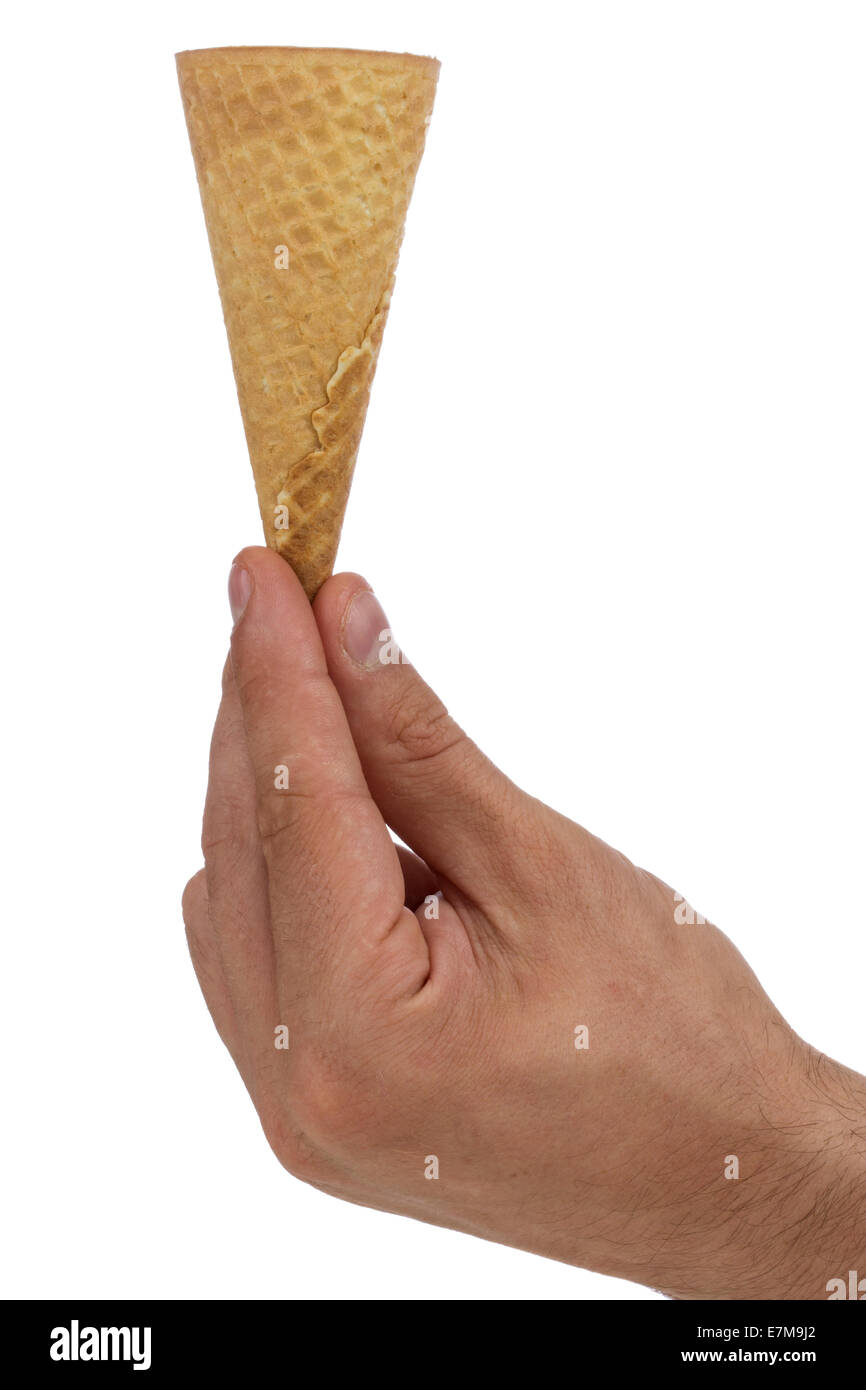 Ice-cream waffle cone in hand isolated on the white background Stock Photo