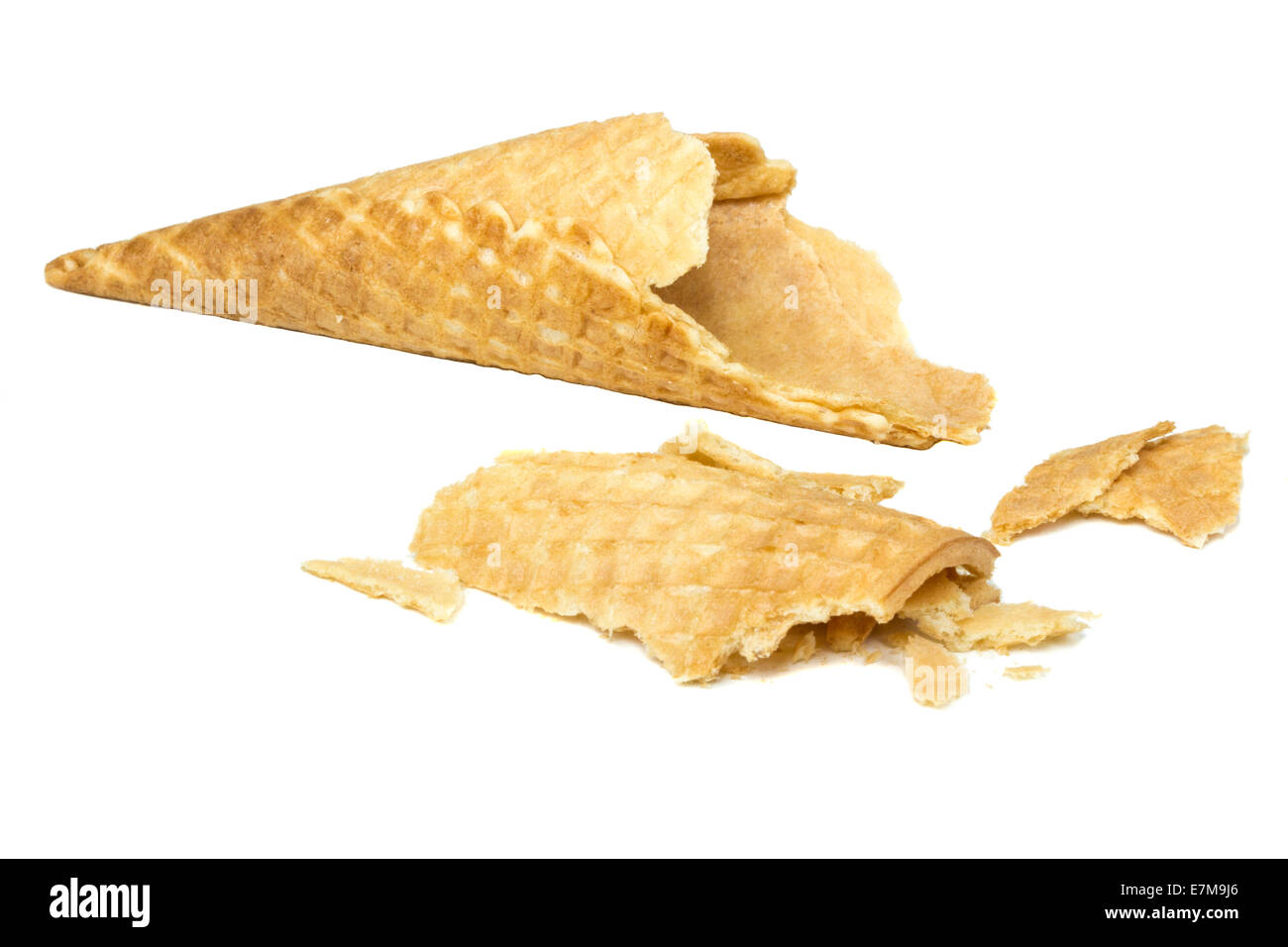 Broken crispy ice cream cone isolated over white background Stock Photo