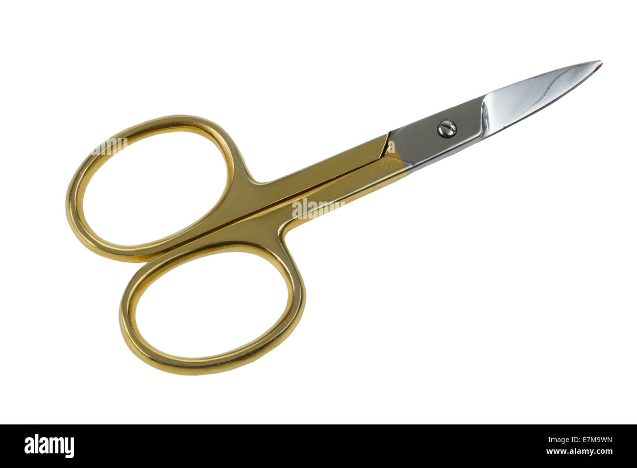 Gold scissors isolated on white background Stock Photo