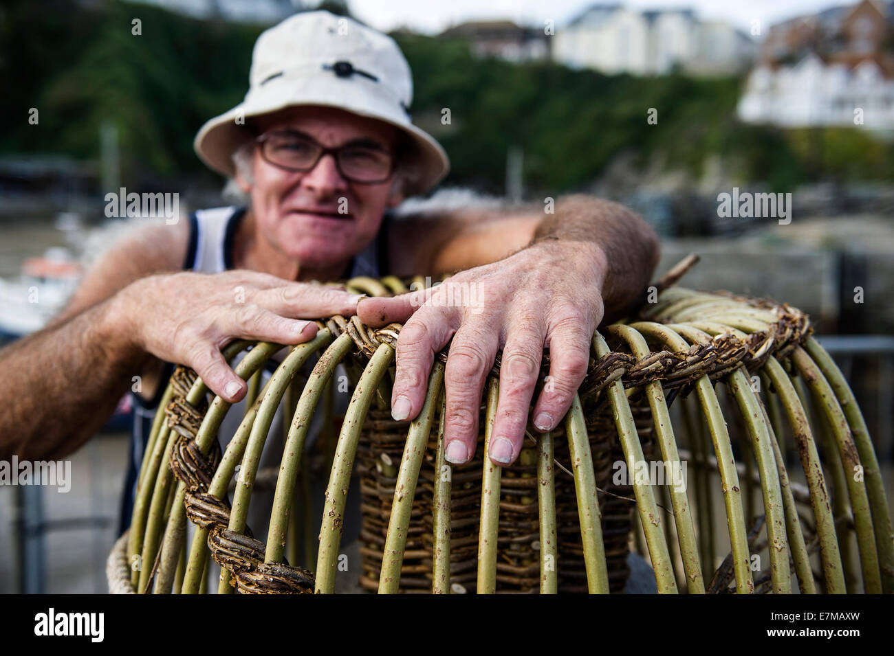 The hands of Richard Ede, one of the last makers of traditional withy lobster pots exhibiting at the Newquay. Stock Photo
