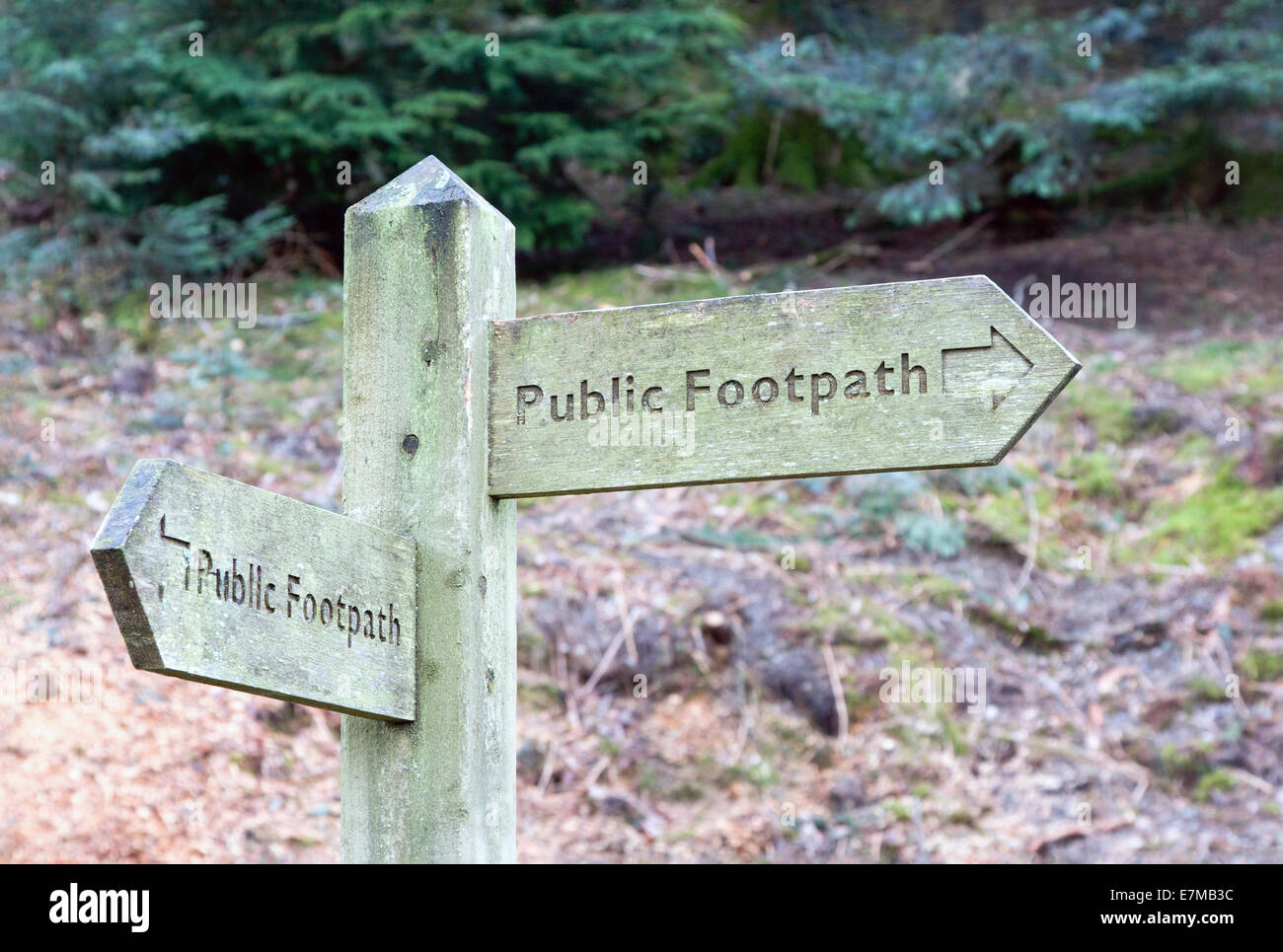 Public footpath finger post showing two different directions Stock Photo