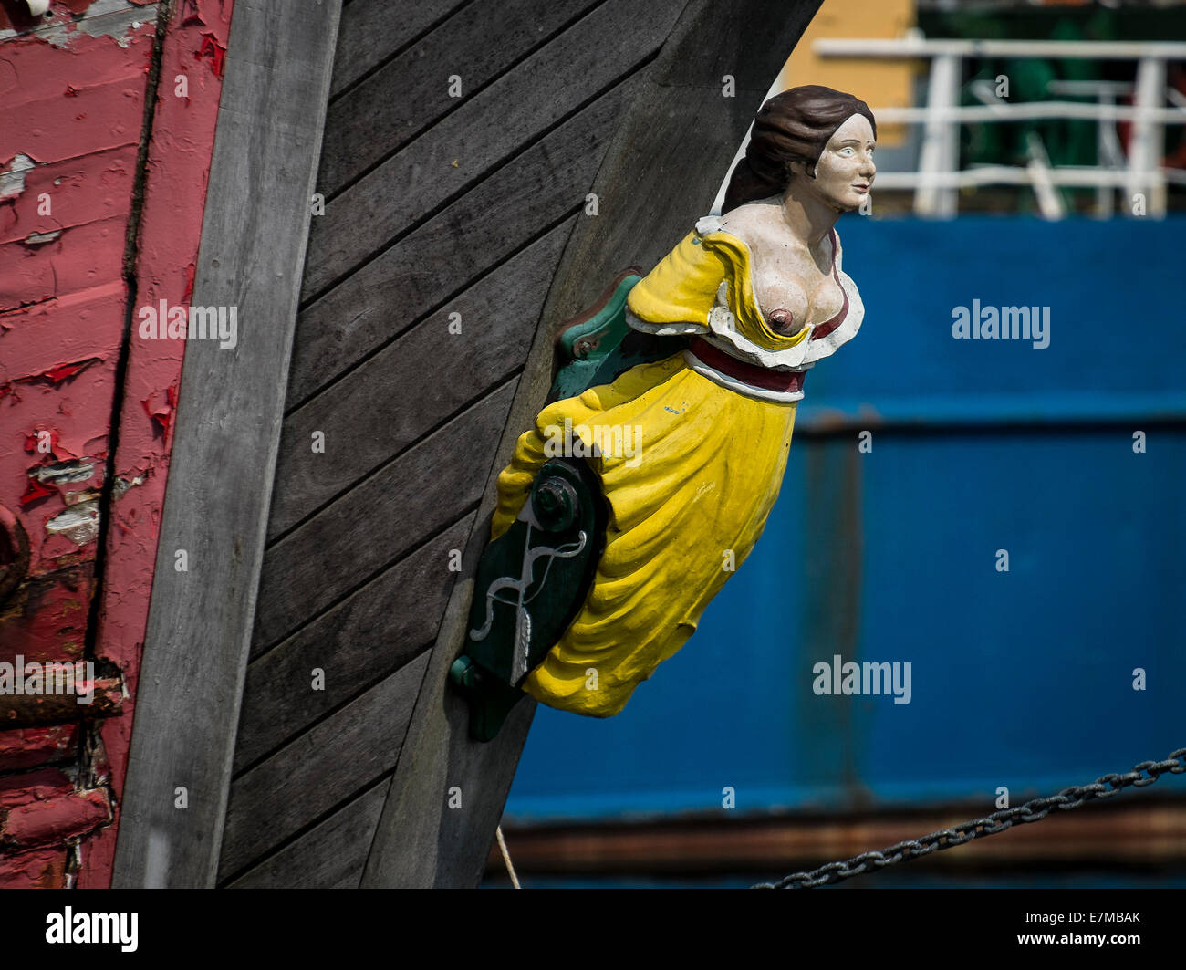 A traditional carved wooden figurehead on the prow of a ship. Stock Photo