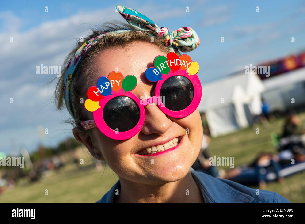 A festivagoer celebrating her birthday at the Brownstock Festival in Essex. Stock Photo