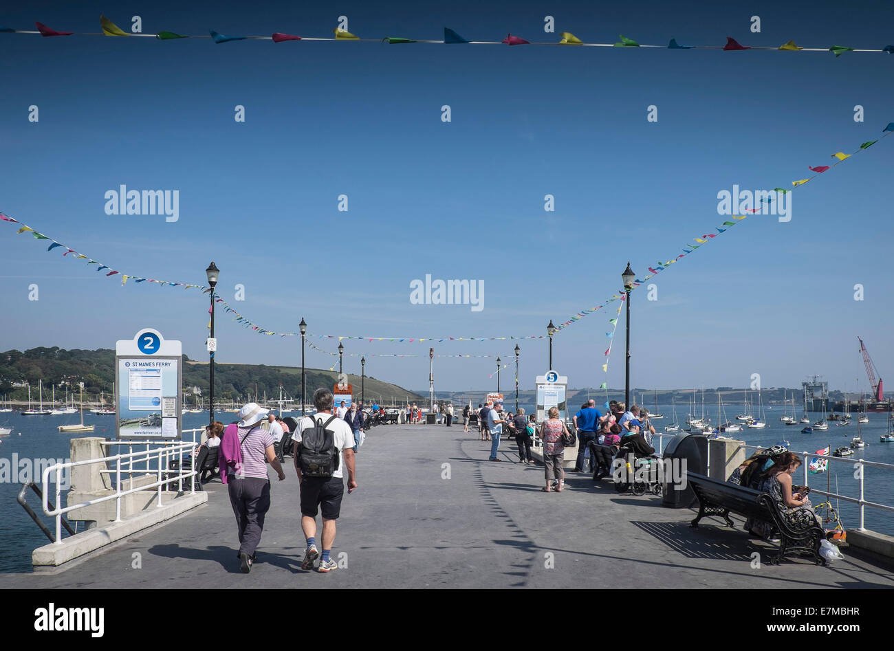 Holidaymakers relaxing on the Prince of Wales Pier in Falmouth. Stock Photo