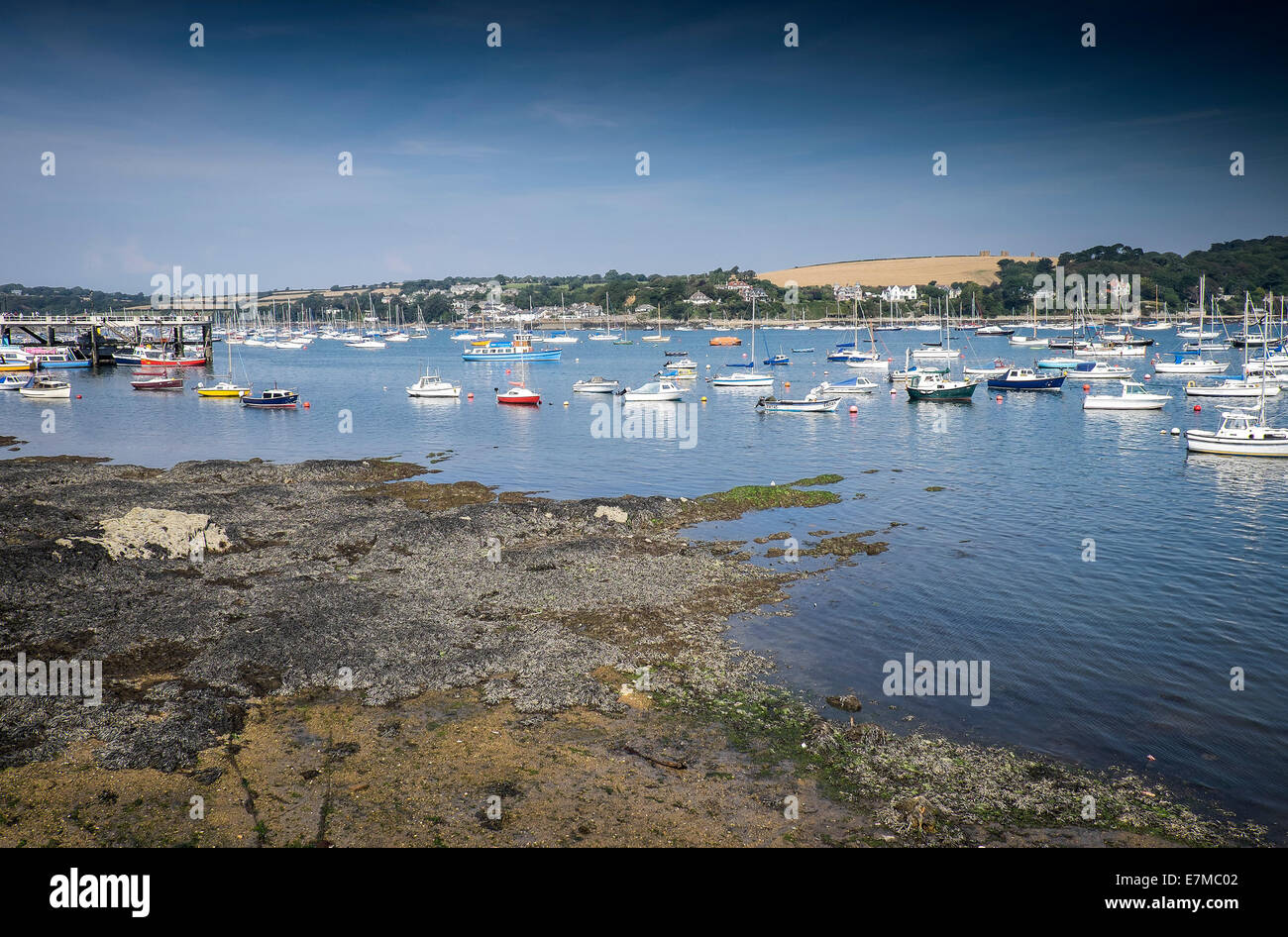 Boats moored in Carrick Roads in Falmouth in Cornwall. Stock Photo