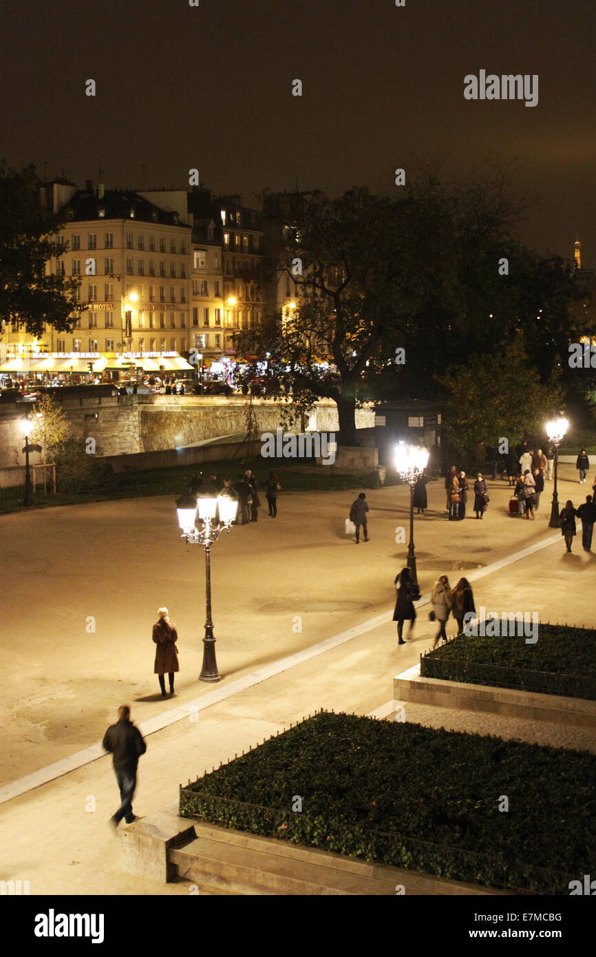 Street scene by night in the city of Paris near Notre-Dame de Paris cathedral, french capital, Ile-de-France, France. Stock Photo