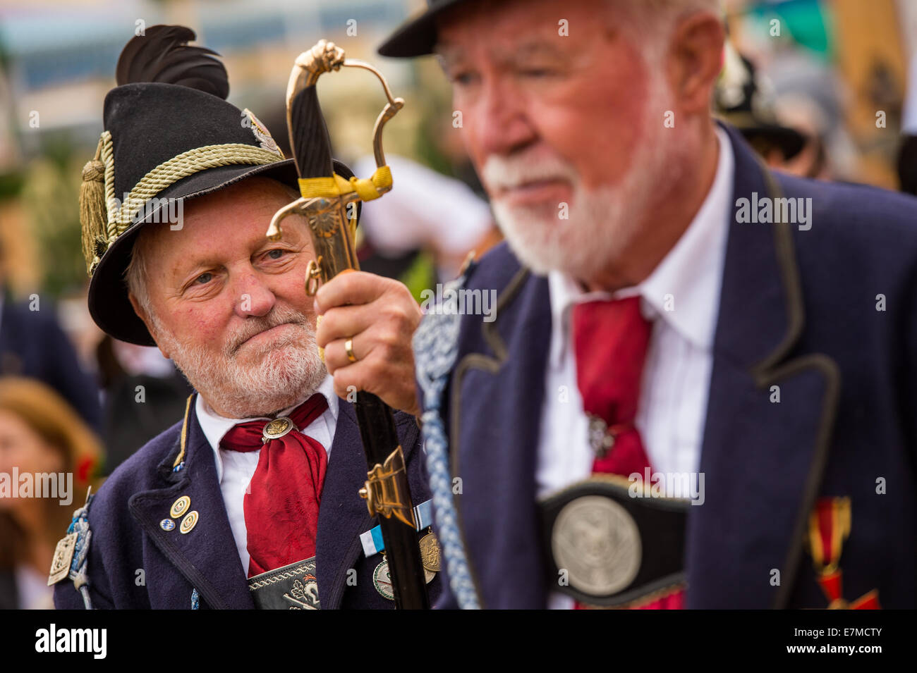 Munich, Germany. 21st Sep, 2014. Men wearing traditional costumes stand in the 'Oide Wiesn' festival tent after the costume and shooting club parade at the Oktoberfest in Munich (Bavaria), Germany, 21 September 2014. The annual beer festival runs from 20 September to 05 October. Photo: Marc Mueller/dpa Credit:  dpa picture alliance/Alamy Live News Stock Photo