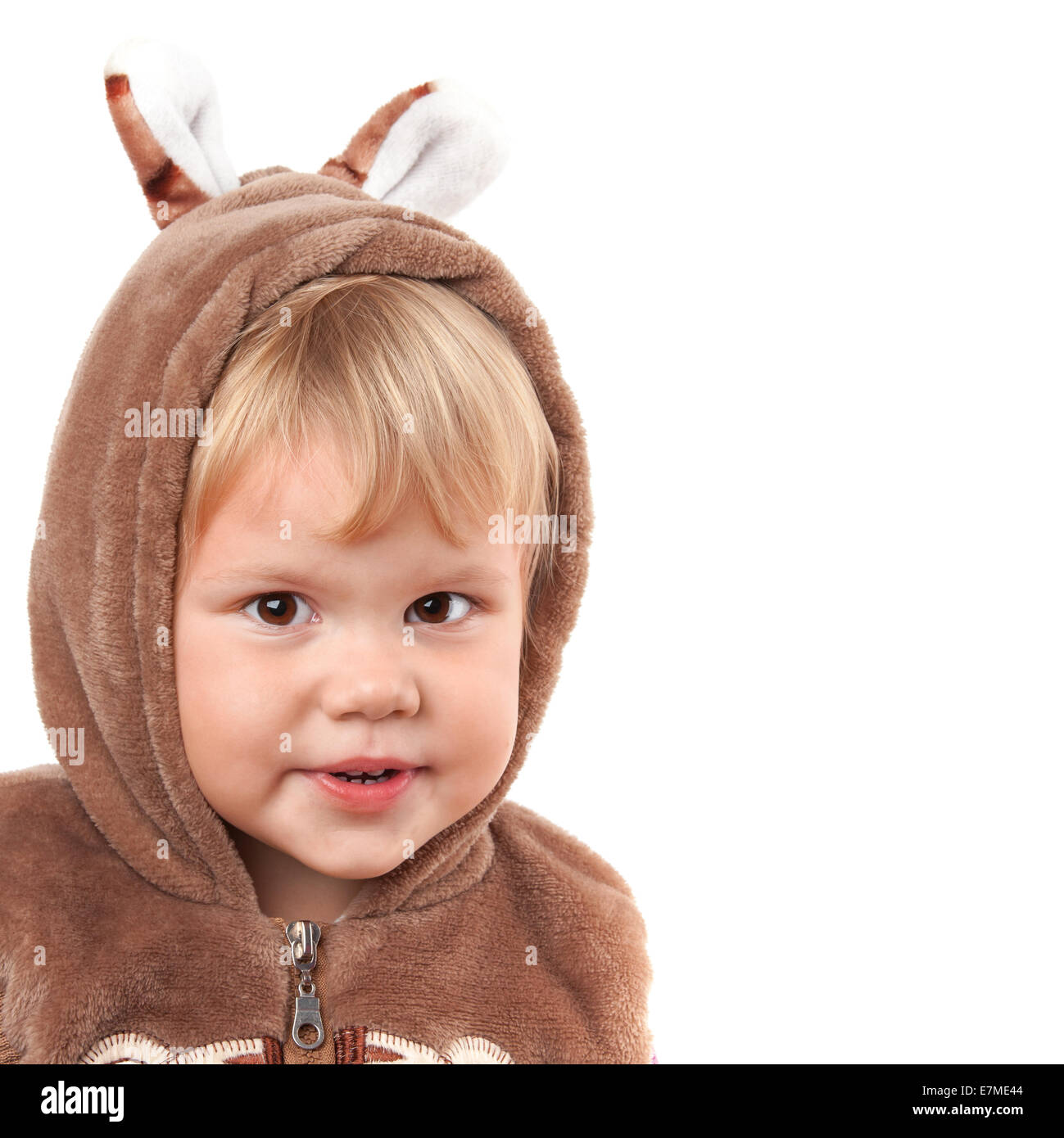 Portrait of smiling Caucasian baby girl in bear costume isolated on white Stock Photo