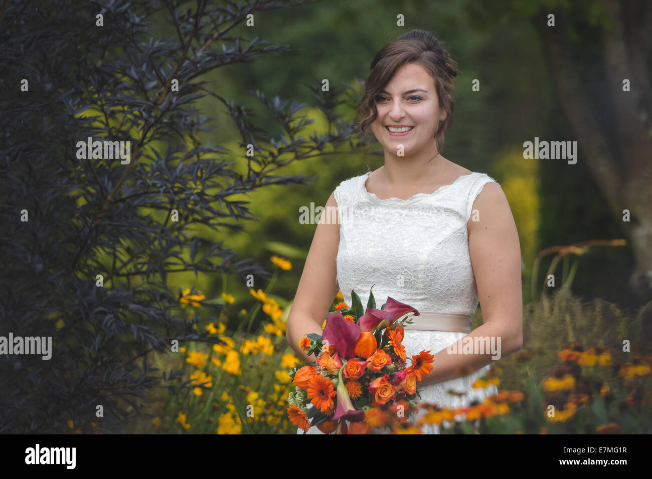 A bride smiling on her wedding day Stock Photo - Alamy
