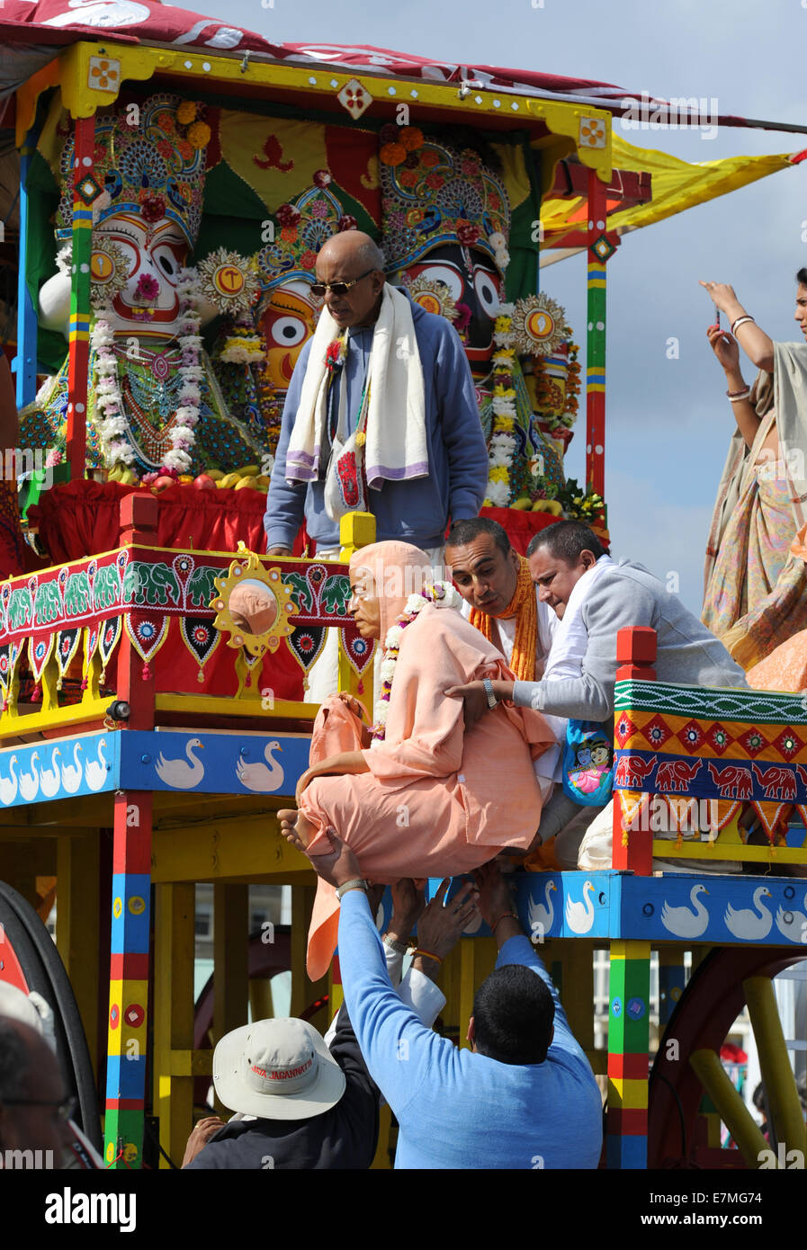 Hove, Brighton, Sussex, UK. 21st September 2014.  Hundreds of Hare Krishna followers take part in the annual  Rathayatra Festival Chariot Parade along Hove seafront Rathayatra is a festival for Lord Krishna and His devotees.  Its an extraordinary spiritual event that originates in Jagannatha Puri on the east coast of India and dates back over 2,000 years. Everyone chants the Hare Krishna maha-mantra  and dances in ecstacy as Krishna in his form of Jagannatha is pulled along on a huge wooden cart to the Peace Statue on Hove seafront and back again  Credit:  Simon Dack/Alamy Live News Stock Photo