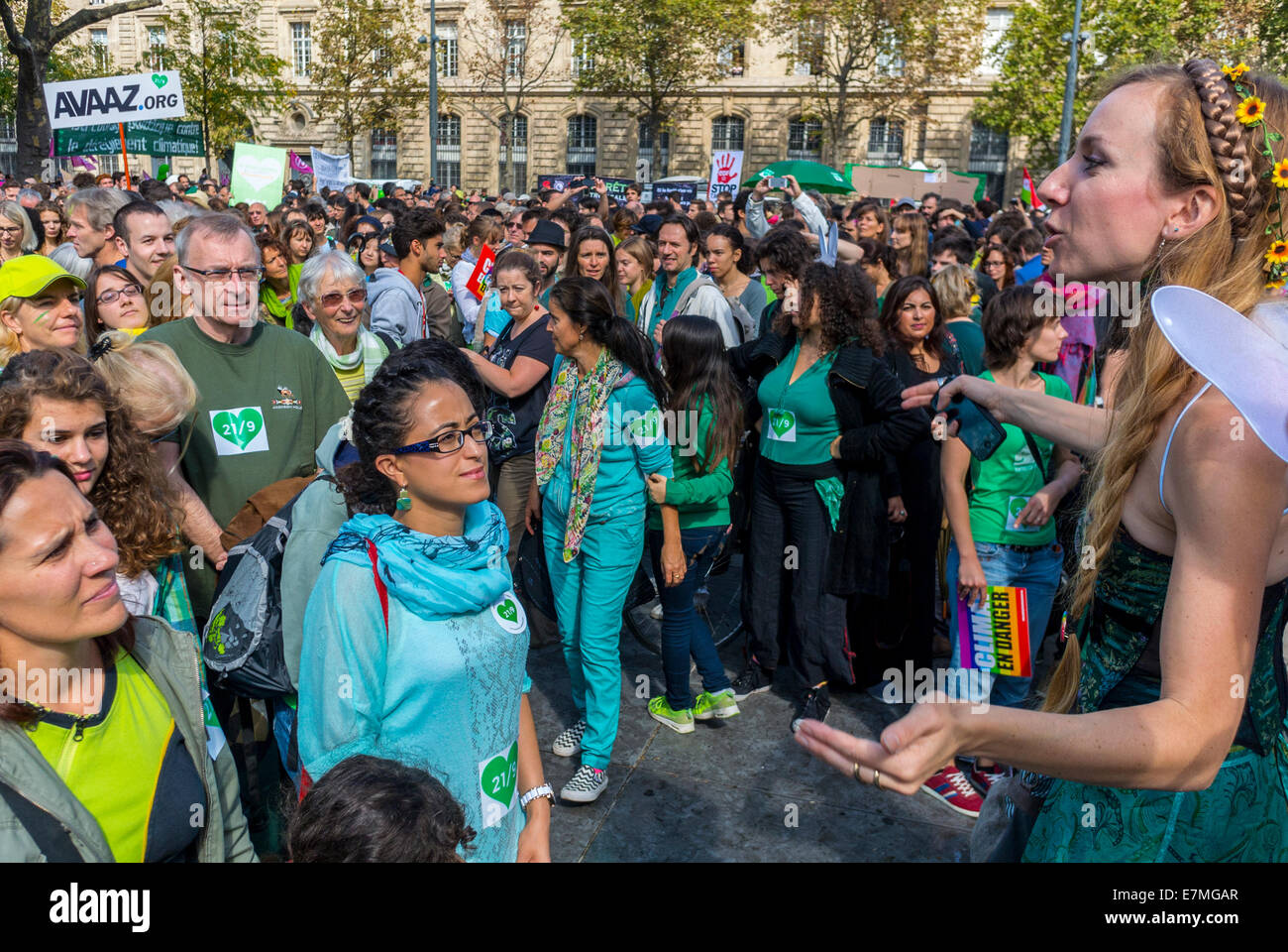 Paris, France. Woman Activist Protest Speaking to large multicultural crowd scene at Public Demonstration Crowds, International Climate Change, Public Speaker, Audience Listening, people march street, manifestation Paris, french crowd diverse, women climate protest Stock Photo