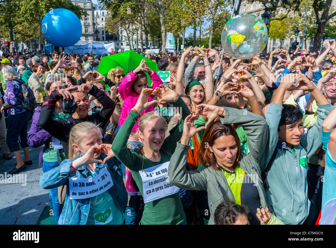 Paris, France. Crowd of Children, Teens on Street, Women Activists Making Heart Sign with Hands at Public Demonstration, International UN Climate Change March Protest international NGO, teenagers activist,  Paris COP 21, solidarity youth movement manifestation secondary school protesting Stock Photo