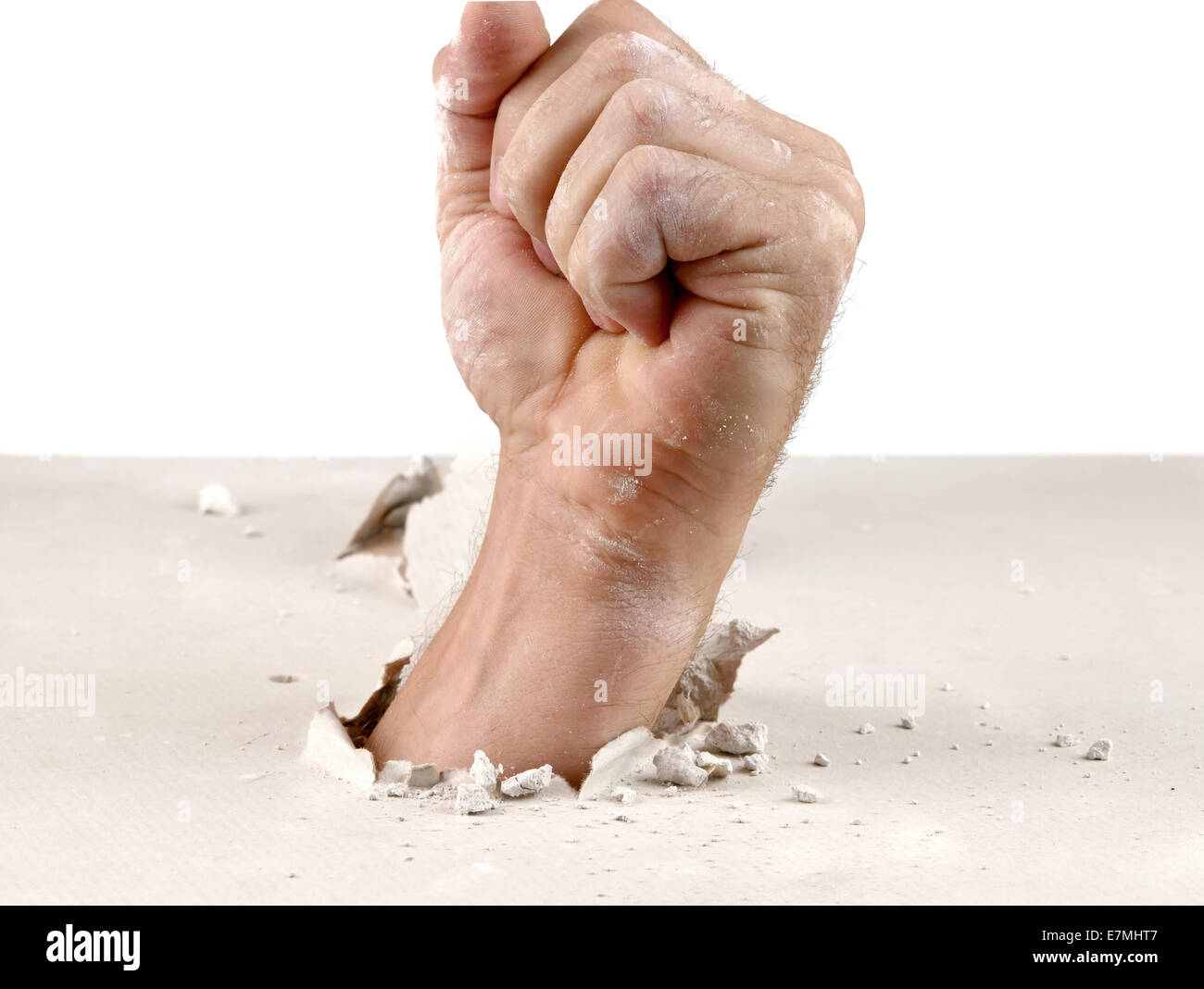 concept. power fist out of wall Stock Photo