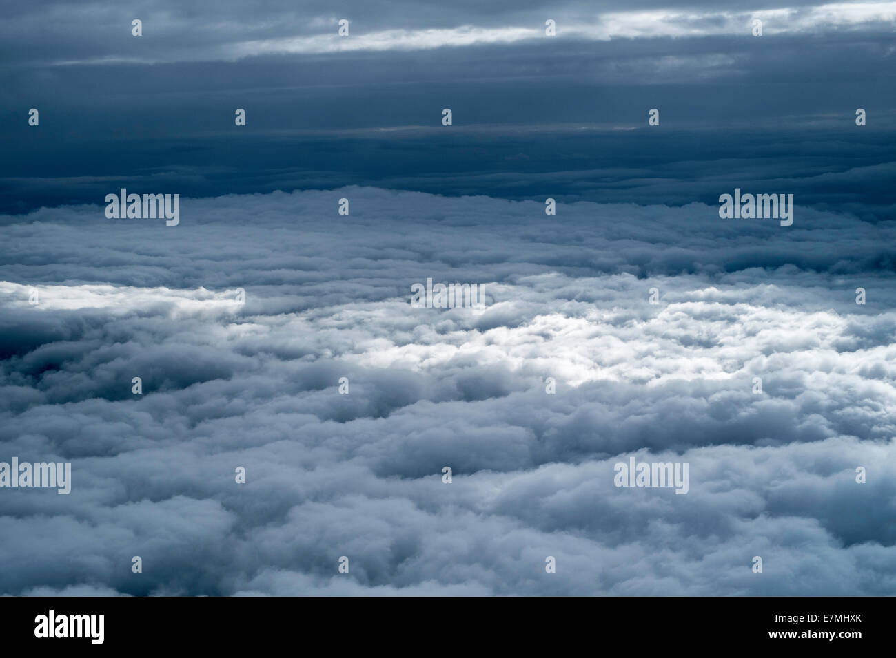 Clouds seen from airplane window seat Stock Photo