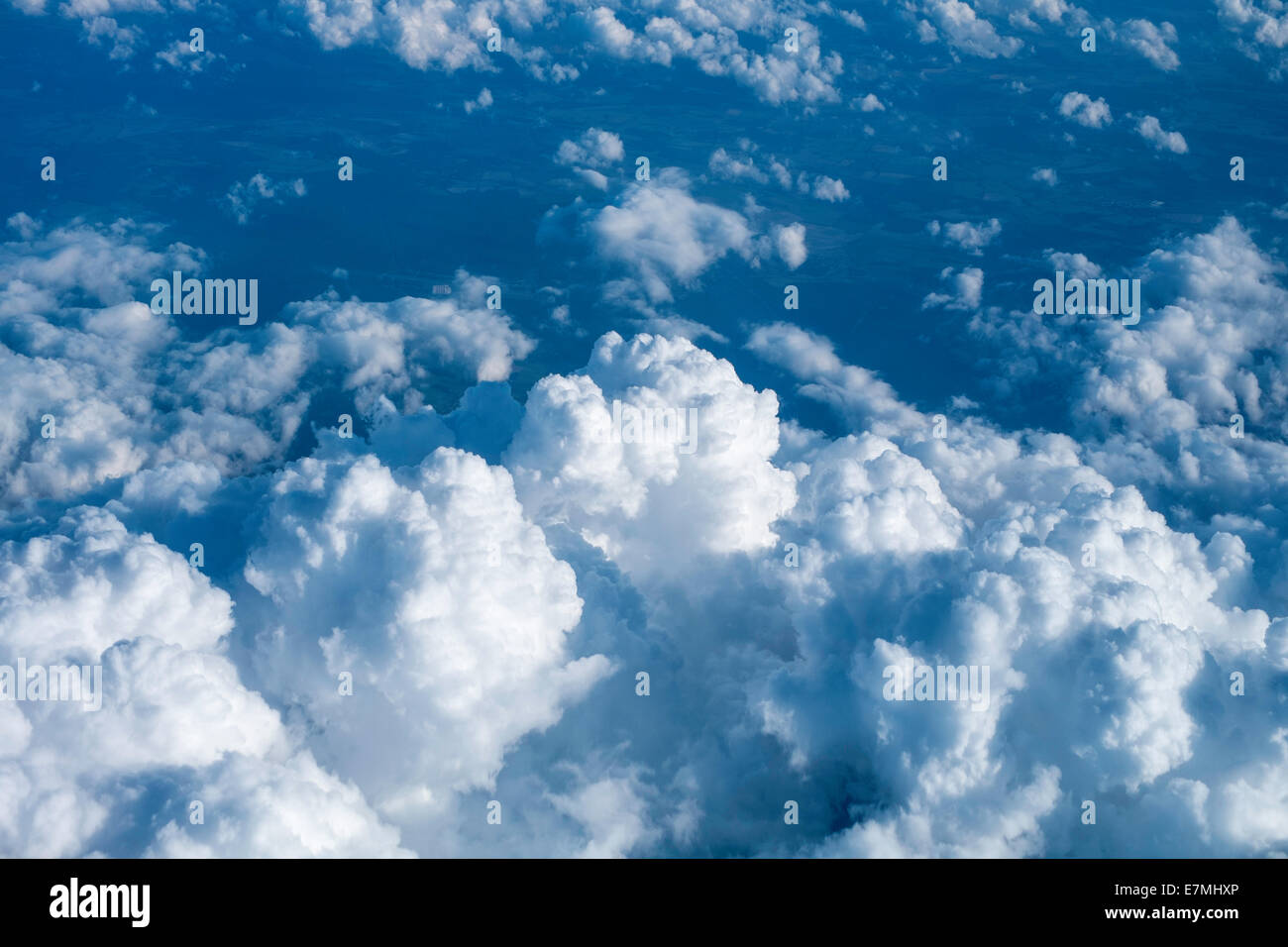 Clouds seen from airplane window seat Stock Photo