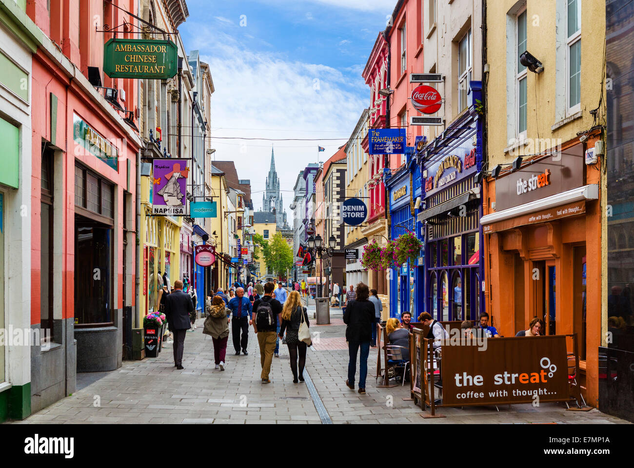 Shops and cafes on Cook Street with Holy Trinity Church in the distance, Cork City, County Cork, Republic of Ireland Stock Photo