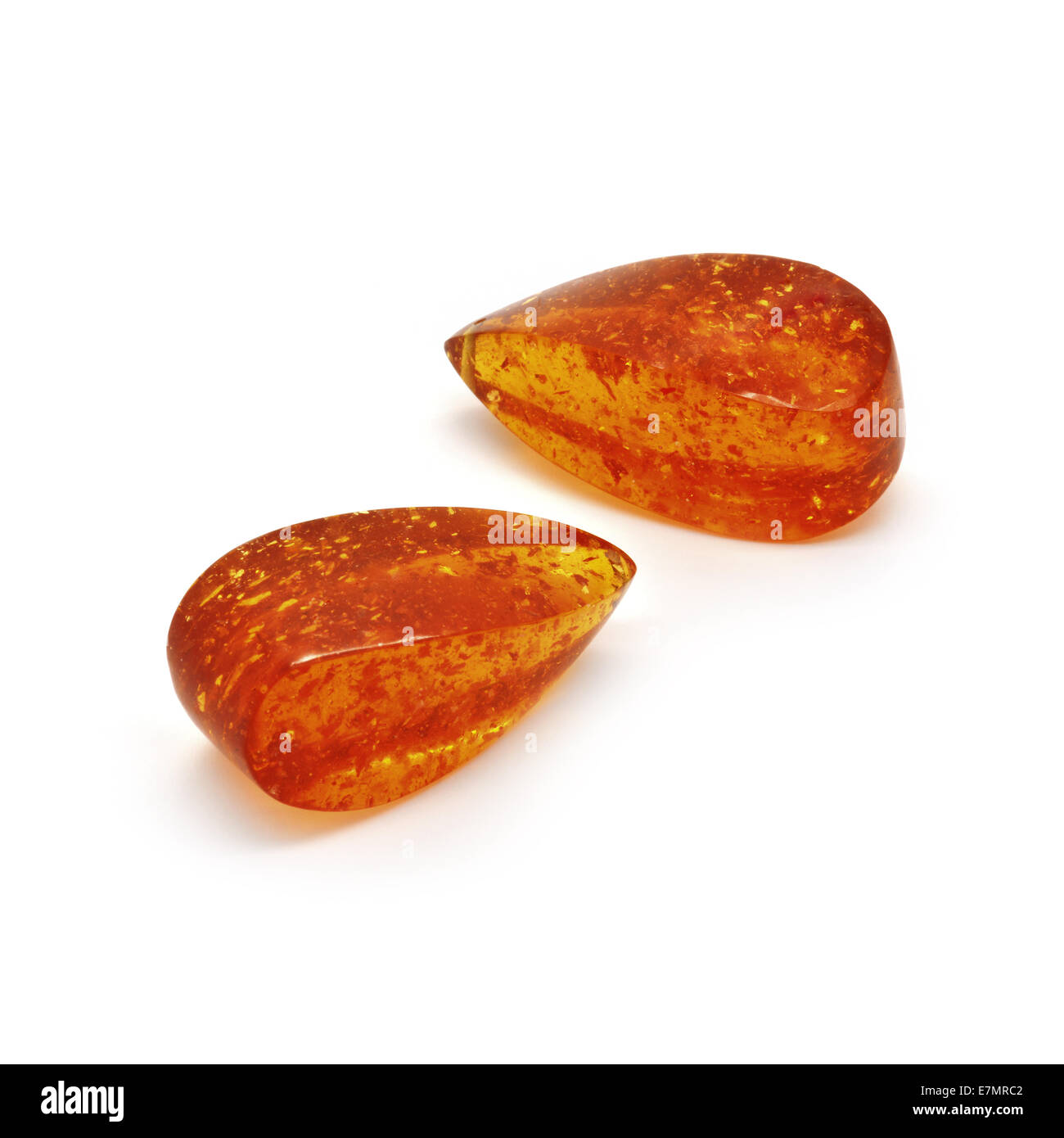 Beautiful amber drops briolette on a white background. Stock Photo