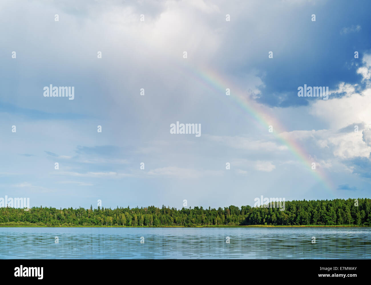Rainbow over lake Stock Photo - Alamy
