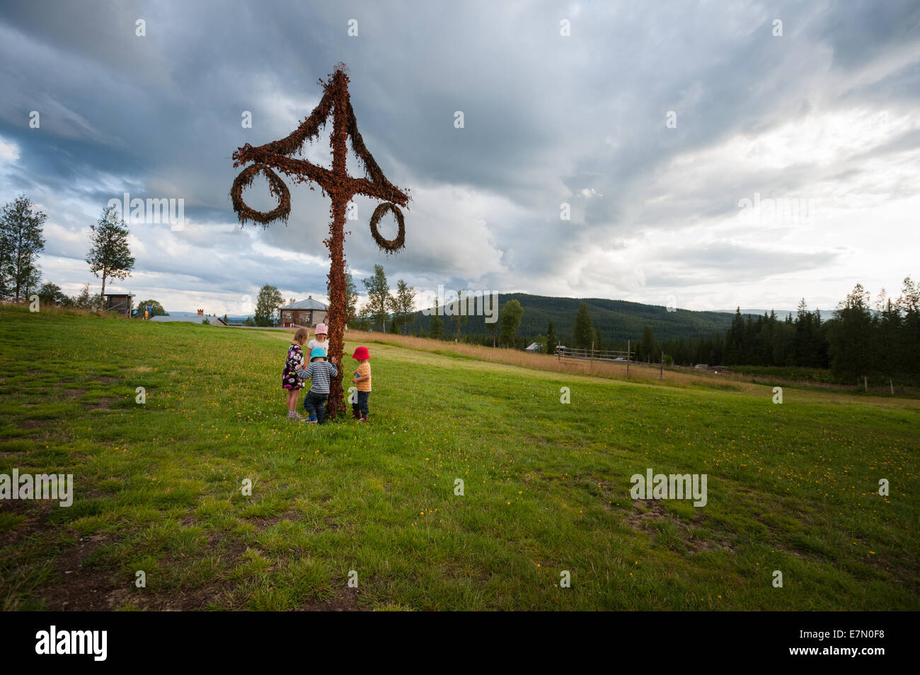 Children dancing around a maypole at Fröä Gruva, Åre, Sweden Stock Photo