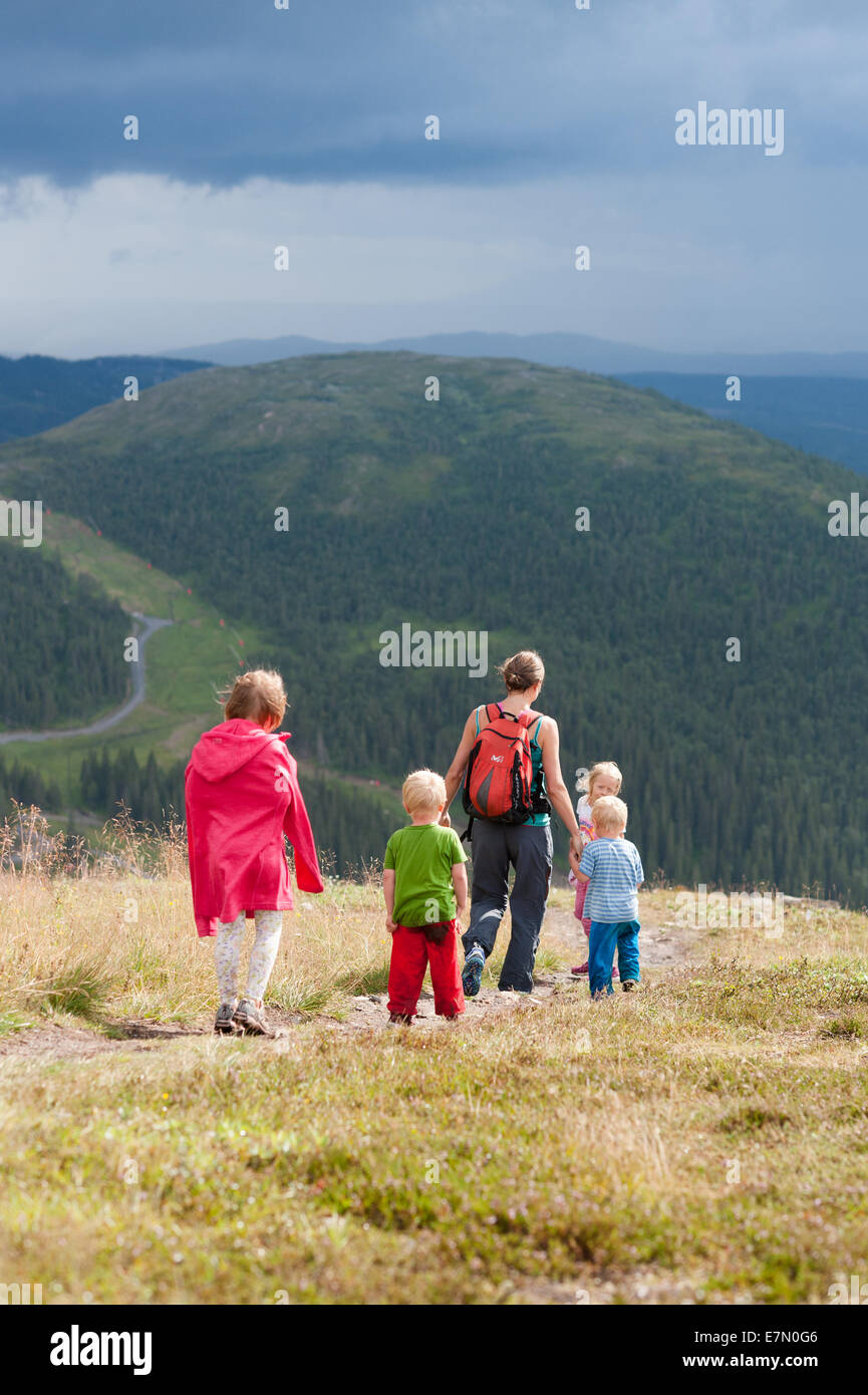 Mum with kids walking on mountain trail, Mt Åreskutan, Åre, Sweden Stock Photo