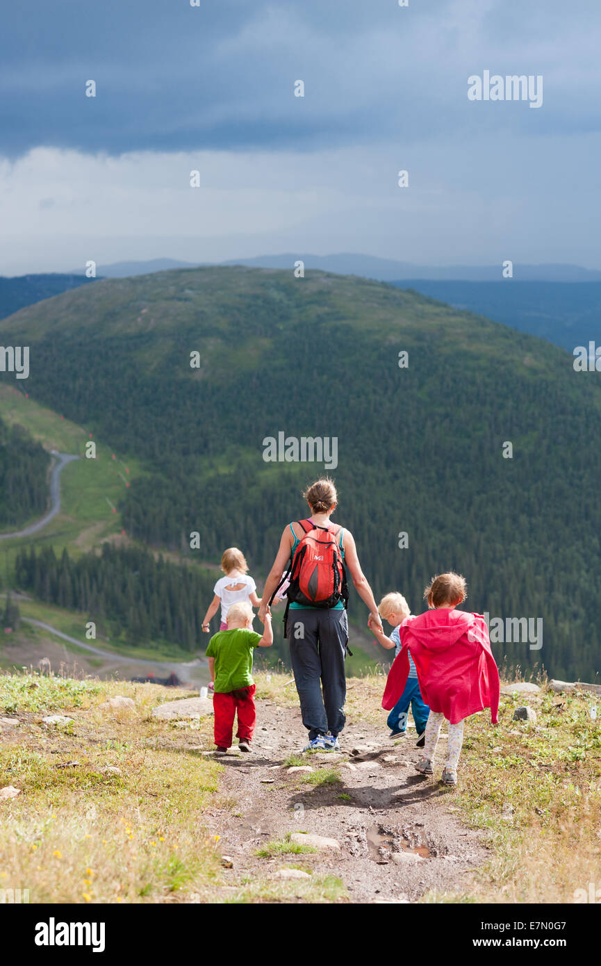 Mum with kids walking on mountain trail, Mt Åreskutan, Åre, Sweden Stock Photo