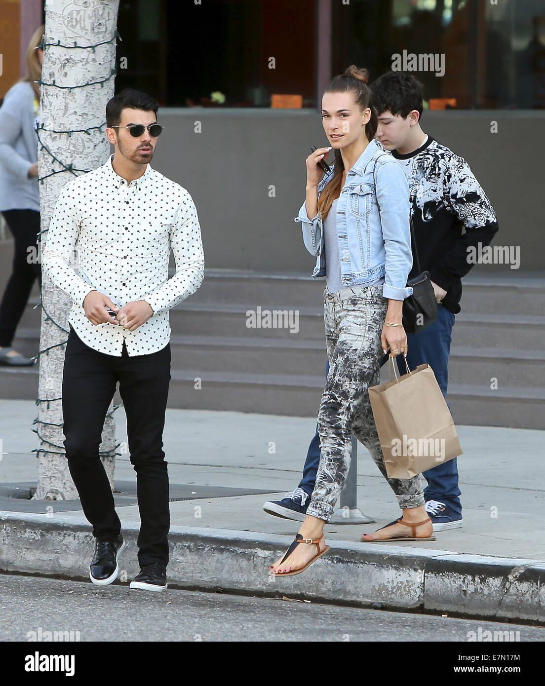 Joe Jonas and Blanda Eggenschwiler leaving Newsroom Cafe with younger
