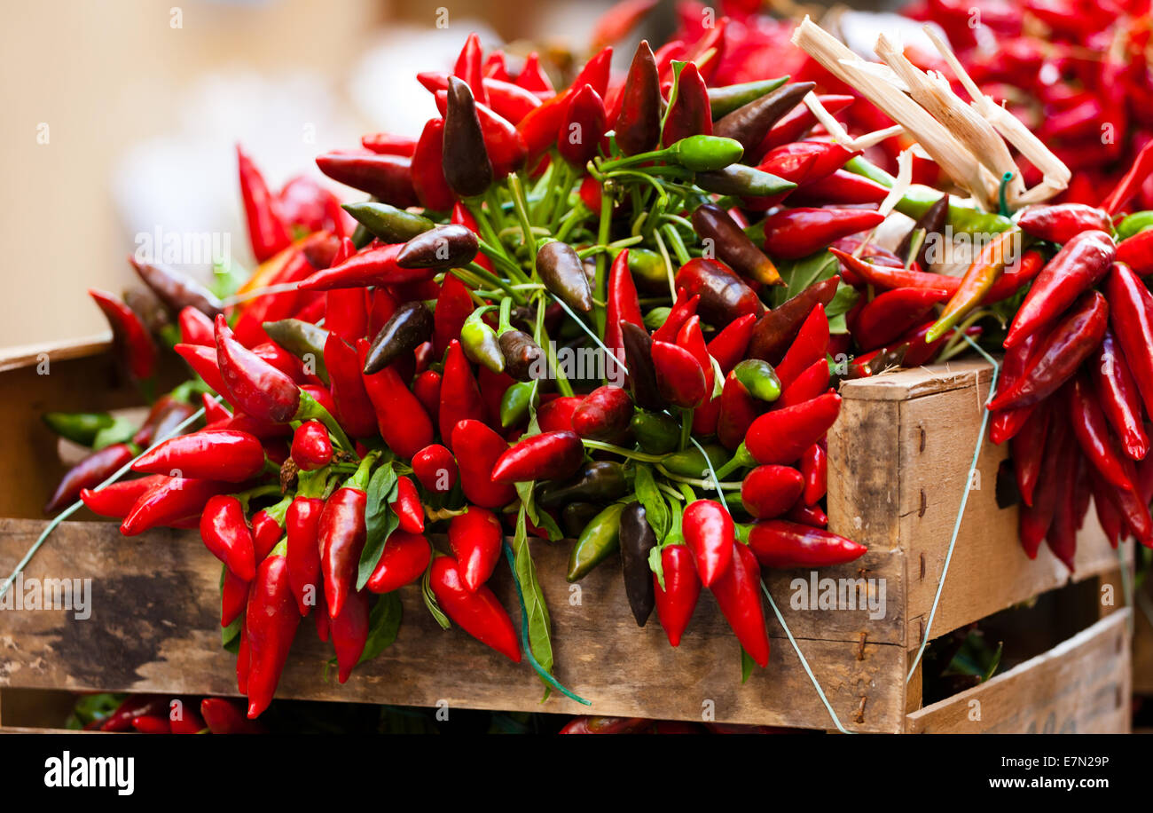 Big bunch of red hot chili pepper at outdoors market Stock Photo - Alamy