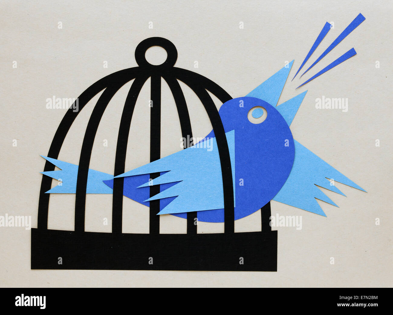 blue bird screaming from the cage Stock Photo