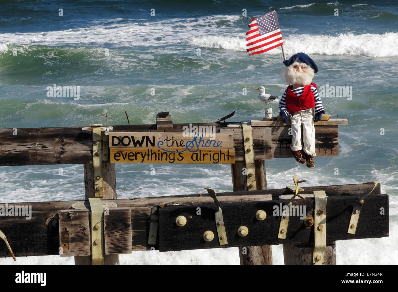 Down the shore everything's alright - doll dressed as an old sailor on a pier in Ocean Grove New Jersey USA Stock Photo