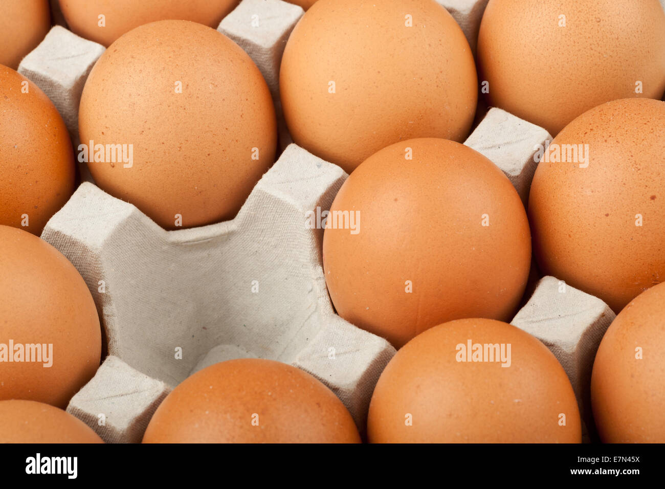 A tray of chicken eggs with one missing Stock Photo