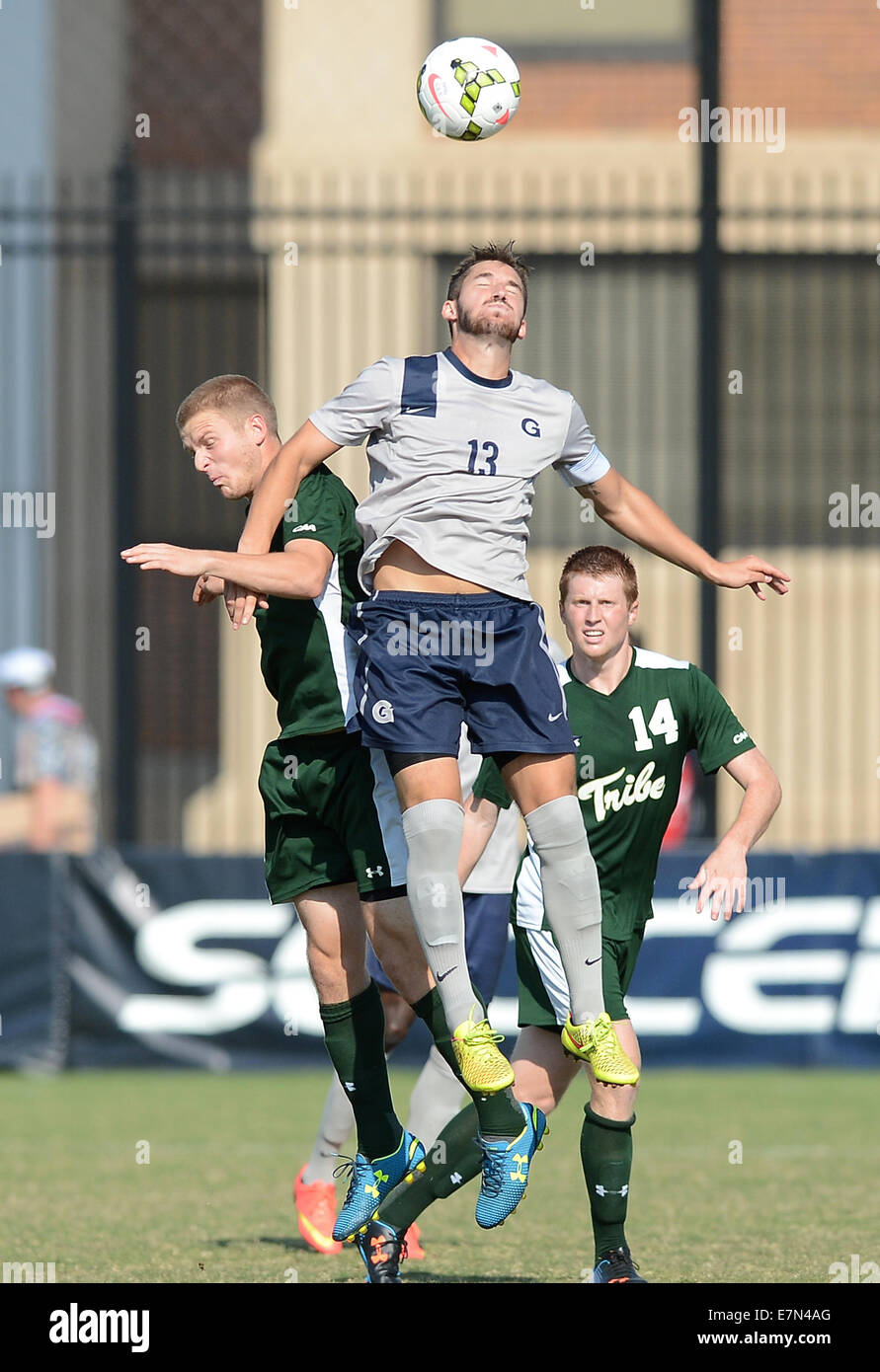 Washington, DC, USA. 21st Sep, 2014. Georgetown midfielder Tyler Rudy (13)  heads the ball against William \u0026 Mary midfielder Ryan Flesch (9), left, in  the first half of an NCAA men's soccer, image size:891x1390