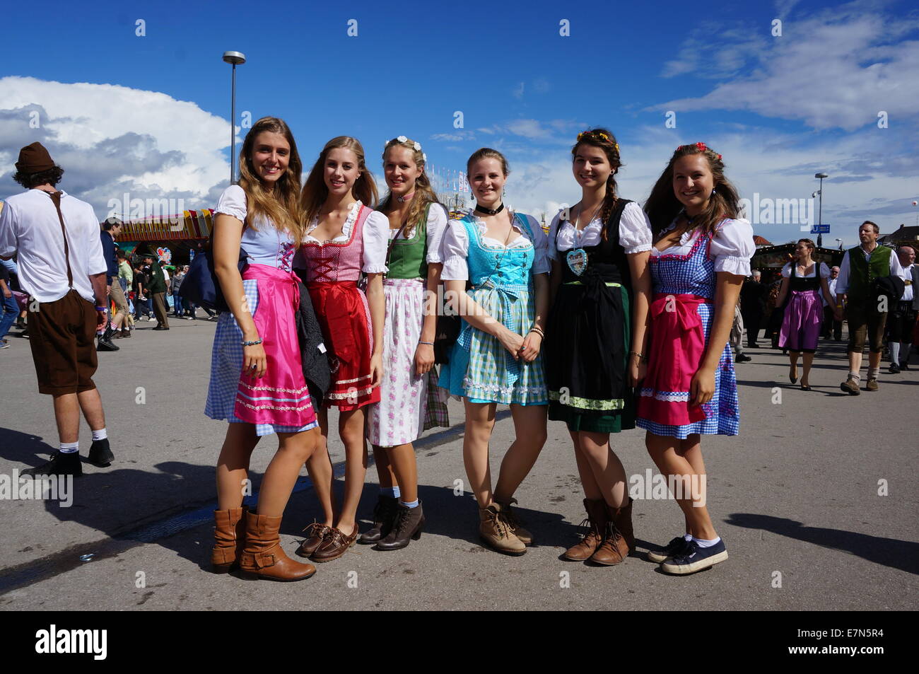 Munich, Germany. 21st Sep, 2014. Girls take part in the Munich Oktoberfest  in Munich, Germany, on Sept. 21, 2014. In spite of changeable weather, the  first weekend of the 181st Munich Oktoberfest