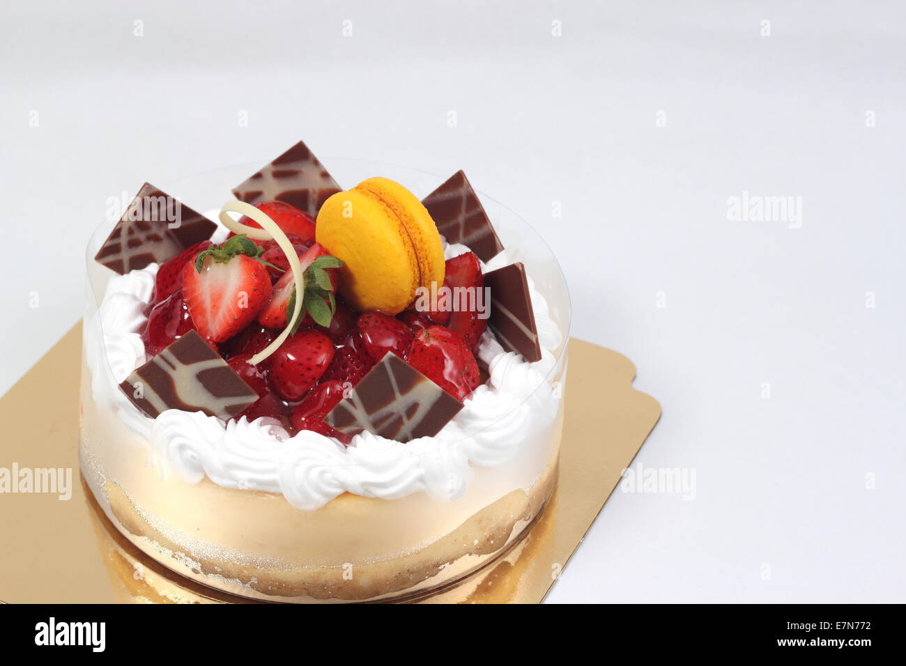 Delicious cheese cake with strawberry fruit toping. Stock Photo