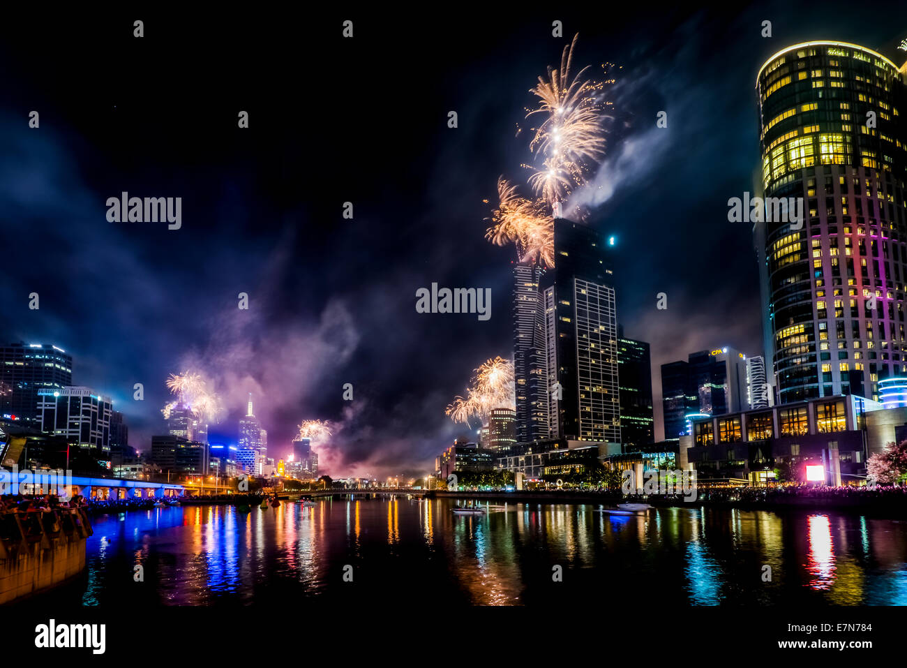 Spectacular fireworks along the Yarra River light up the night sky over Melbourne Australia. Stock Photo