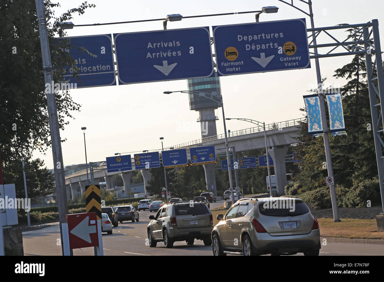 Vancouver, BC Canada - August 17,  2014 : Arrivals and departures road sign in YVR airport in Vancouver BC Canada. Stock Photo